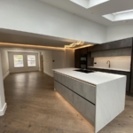 warm lighting kitchen island open plan